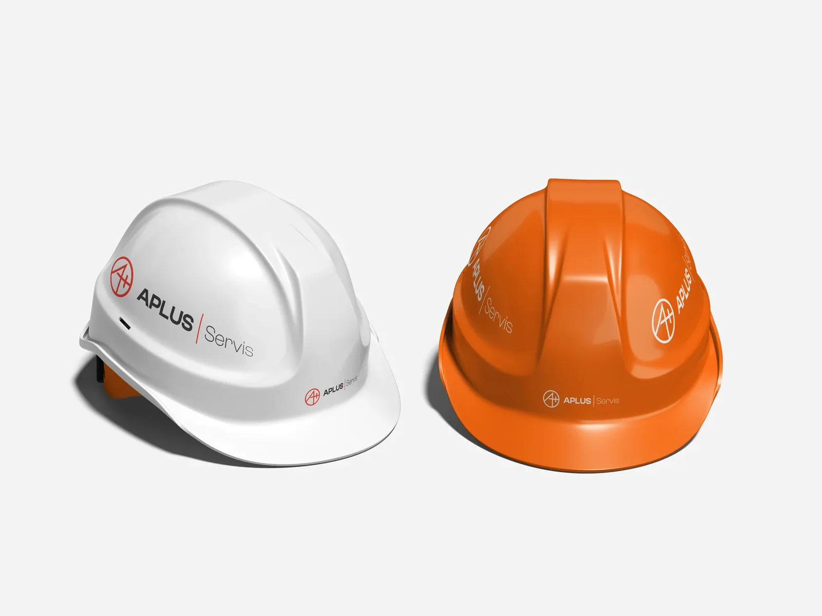 Aplus Servis logo on white and orange hard hats